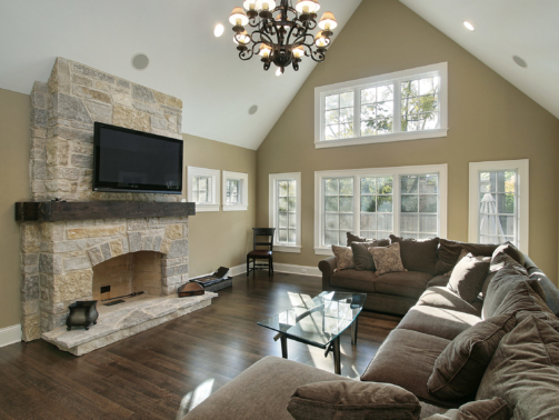 Family room in luxury home with stone fireplace