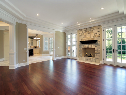 Living room in new construction home with stone fireplace